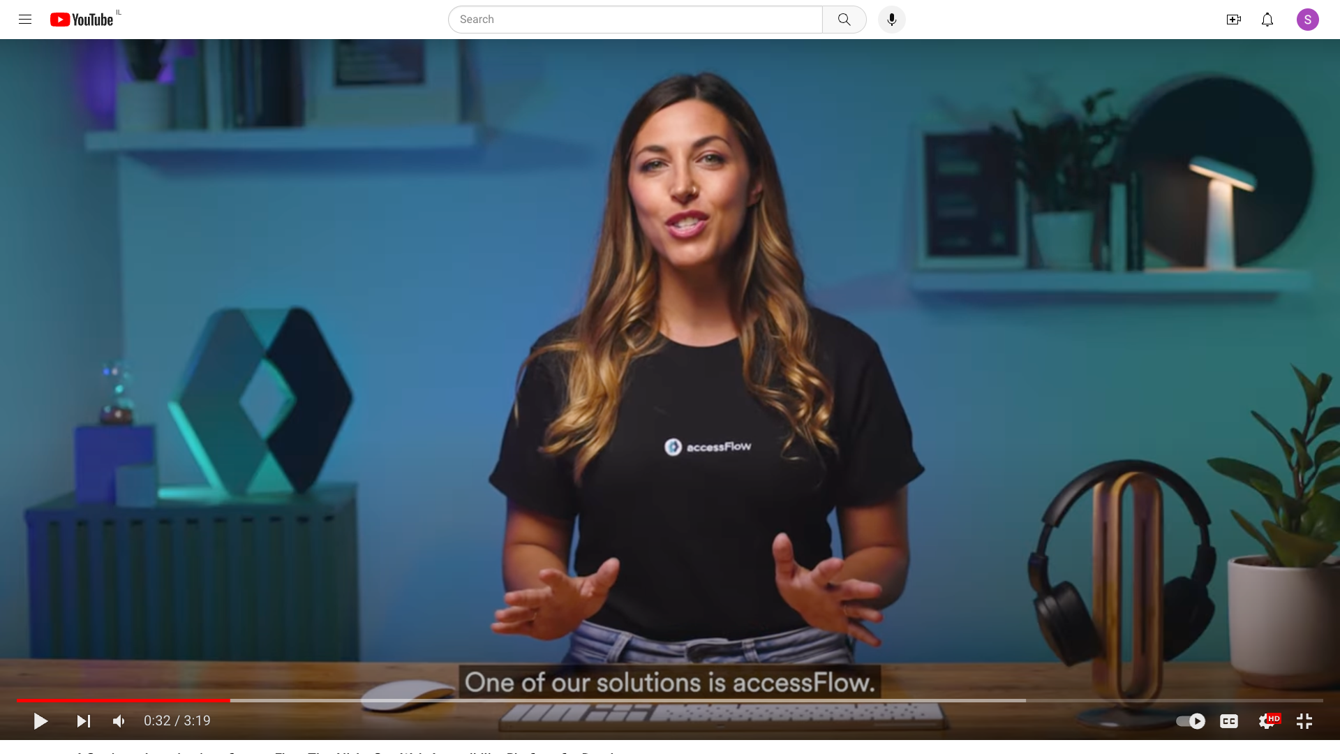 Video shot of a brunette girl in an accessiBe shirt with captions at the bottom of the screen