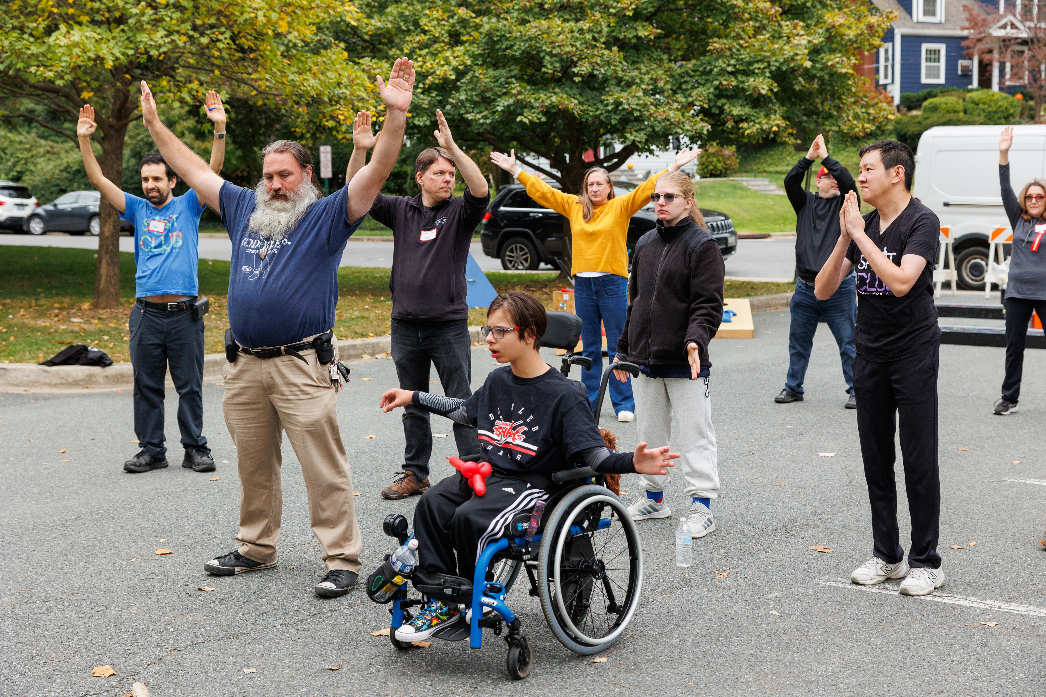 athletes of different abilities stretching in a group setting
