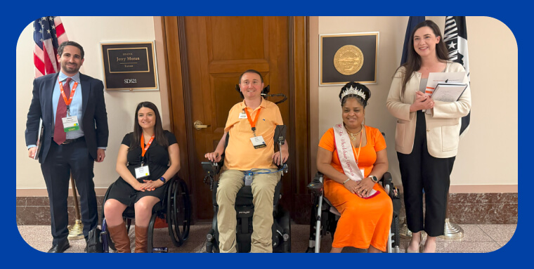 Josh Basile and other disability advocacy posing in a congressional hallway.